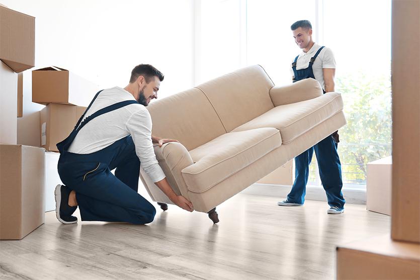 2 guys moving a sofa